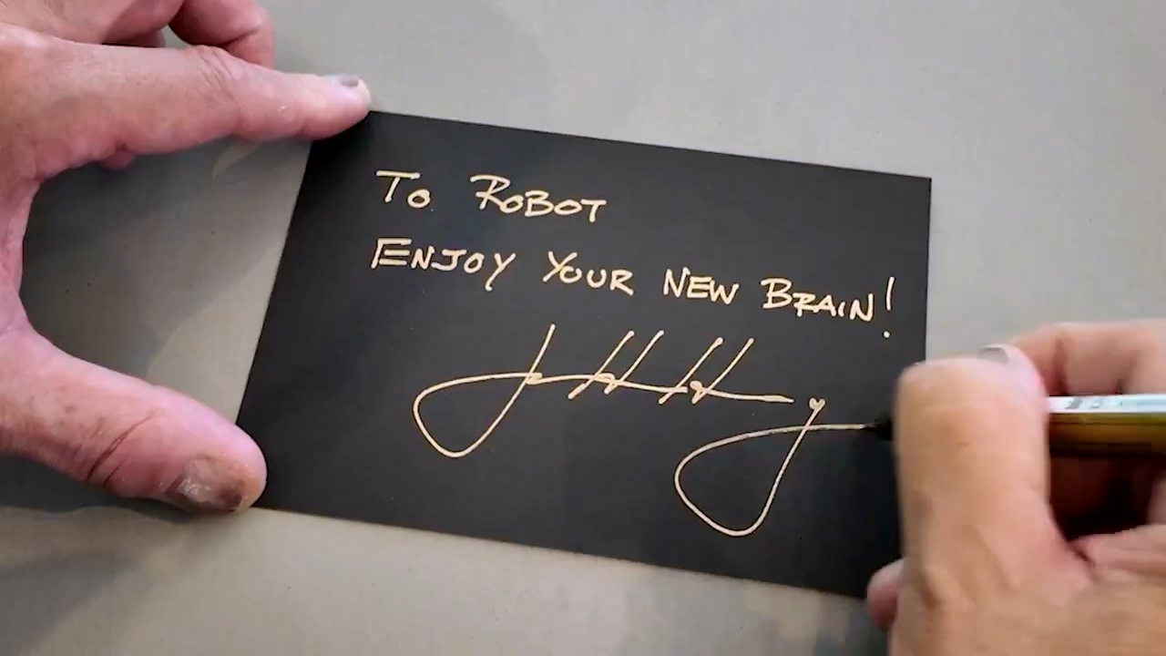 黄仁勋亲笔签名预告贺卡,英伟达将为人形机器人推“新大脑” 黄仁勋亲笔签名预告贺卡,英伟达将为人形机器人推“新大脑”